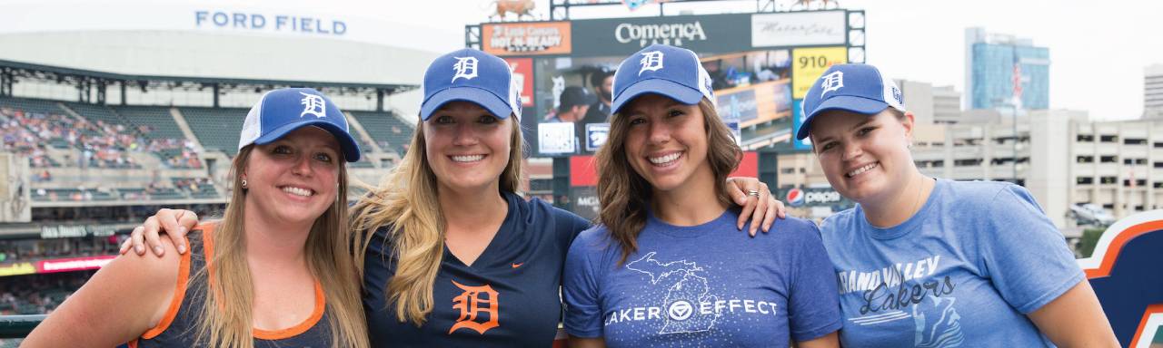 Group of young women standing together at Tigers baseball game
